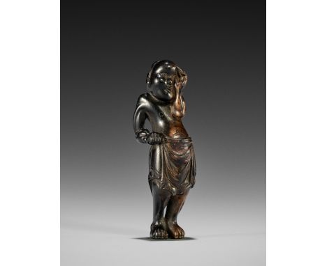 A KOKUTAN WOOD NETSUKE OF OKAME COMBING HER HAIR  UnsignedJapan, 19th century, Edo period (1615-1868)The Shinto goddess of mi