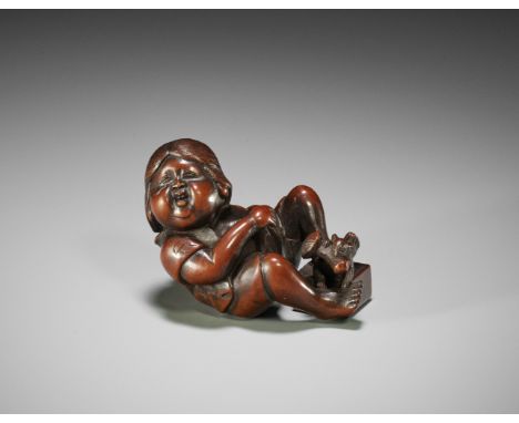 TOKIMITSU: A RARE SHUNGA WOOD NETSUKE OF OKAME AS A RAT CATCHER  By Tokimitsu, signed Tokimitsu 時光Japan, 19th century, Edo pe