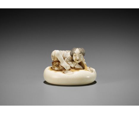 ISHIKAWA RENSAI: A SUPERB IVORY NETSUKE OF A FISHERMAN SUBDUING A FUGU (BLOWFISH)By Ishikawa Rensai, signed Rensai 蓮齋Japan, T