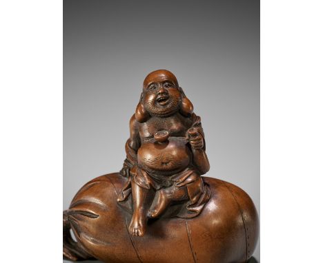SHOKO SUGANOYA: A WOOD NETSUKE OF HOTEI DRINKING SAKEBy Shoko Suganoya, signed Shoko 尚古Japan, Takayama, Hida province, second