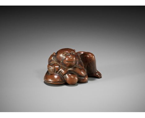 A WOOD NETSUKE OF A MONKEY, GOURD AND NAMAZUUnsignedJapan, second half of 18th century, Edo period (1615-1868)Well-carved as 