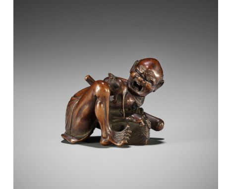 MASAYOSHI: A FINE WOOD OKIMONO NETSUKE OF A RAT CATCHERBy Masayoshi (Seikei), signed Masayoshi 正慶Japan, Nagoya, late 19th cen