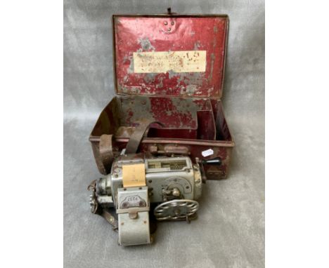 A VINTAGE BUS CONDUCTORS TICKET MACHINE, in a metal case