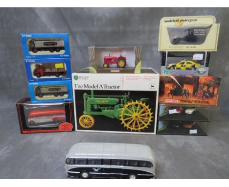 A MIXED BOX OF DIE CAST VEHICLES, to include boxed John Deere model A tractor, Universal Hobbies Massey Harris 1949 tractor, 