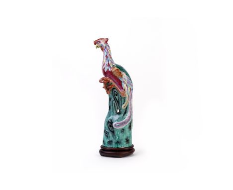 A LARGE FAMILLE ROSE PORCELAIN MODEL OF A PHOENIX 19th Century Modelled perched on a rock, with vibrant colourful feathers, o