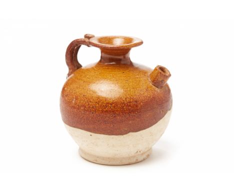 A SMALL BROWN-GLAZED GLOBULAR POTTERY EWERTang Dynasty, according to the collector's inventory The upper body with a light br