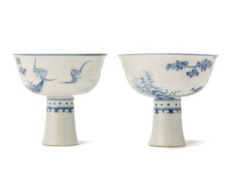 A PAIR OF BLUE AND WHITE PORCELAIN STEM CUPS
Decorated with tree blossom and animals to the exterior, the interior with auspi