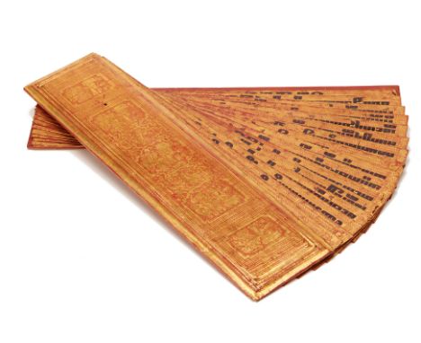 A BURMESE KAMMAVACA MANUSCRIPT
Red lacquer and gilt decoration
5cm high x 61cm wide x 14cm deep
Condition: Minor signs of wea