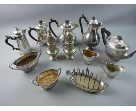 A LARGE PARCEL OF MIXED ELECTROPLATE including a three piece tea service, sundry coffeepots, pair of sugar castors and toast 