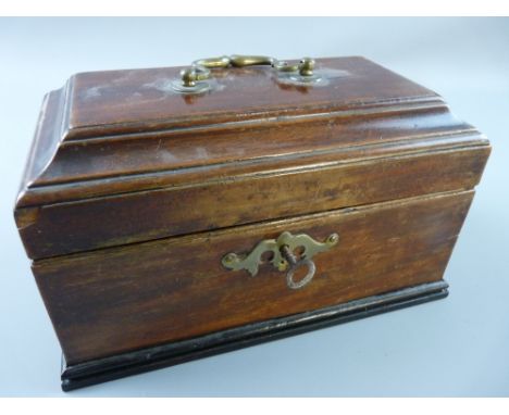 A GEORGIAN MAHOGANY OBLONG TOP TEA CADDY with metal top handle, interior lidded tea compartment with glass blender along side