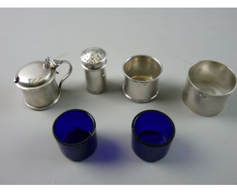 A SET OF THREE PLAIN SILVER CAPSTAN SHAPED CONDIMENTS, the mustard and salt pots with Bristol blue liners, 1.5 troy ozs, Birm