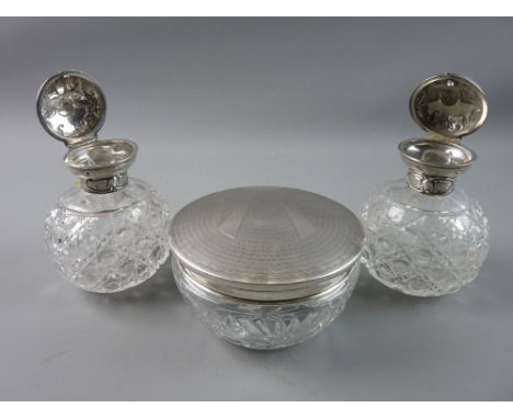 THREE HALLMARKED SILVER AND GLASS DRESSING TABLE ITEMS to include two hobnail cut scent bottles with hinged silver lids and i