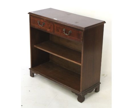 A 20th century mahogany cabinet. With two upper drawers over an open shelf, raised on bracket supports, L79cm x D33cm x H78cm