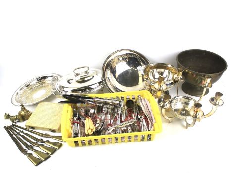 An assortment of metalware. Including brass gun models, flatware, a candlestick, tureen, etc.