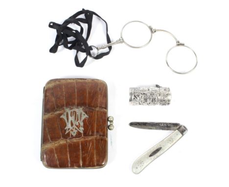 A collection of antique silver and white metal items. Including: a fruit knife, pill box, a leather purse, and a folding lorg