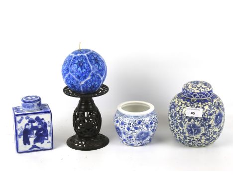 An assortment of Chinese style ceramics. Including ginger jars, tea caddy vase, a candle stick, etc.