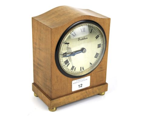 A contemporary Frodsham mechanical mantel clock. With wooden arched top case on metal bun feet, H17cm