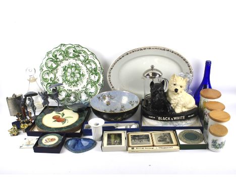 An assortment of ceramics and glassware. Including a decanter, decorative plates and bowls, hip flask, etc.