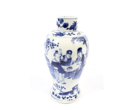A small 19th century Chinese blue and white vase. Decorated with figures, with apocryphal four character Kangxi to the unders