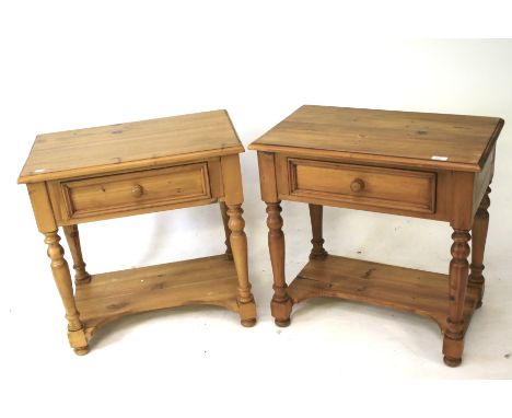 A pair of pine single drawer side tables. On turned supports with low shelf stretcher below, L66cm x D40cm x H66cm