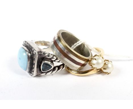Three contemporary white metal and gilt metal rings. Comprising an imitation pearl example, size K/L, one set with turquoise,