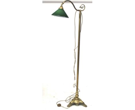A 20th century standing floor lamp. The brass frame mounted on a tripod base, with a green glass shade, H170cm