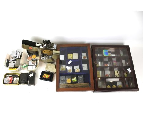 A collection of Zippo lighters. A good range of sizes, some reproductions 