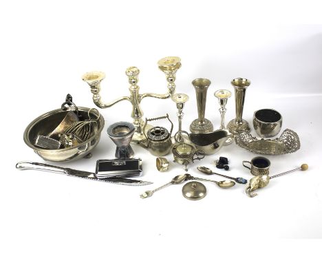An assortment of silver plate. Including a candlestick, posy vases, a sauceboat, etc.