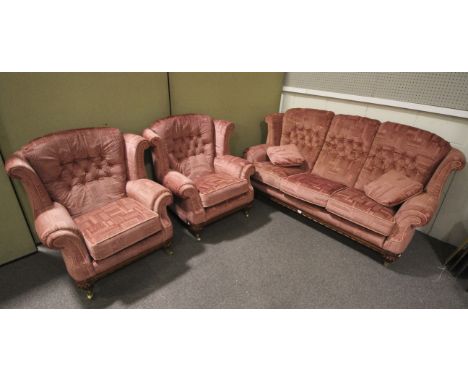 A modern three piece suite. Consisting of a triple seat sofa, L180cm x W80cm, and pair of chairs L91cm x W80cm, pink patterne