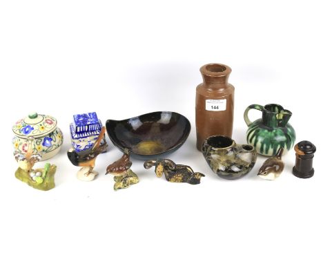 An assortment of ceramics. Including a Poole lidded pot, Beswick birds, a studio pottery jug, etc.
