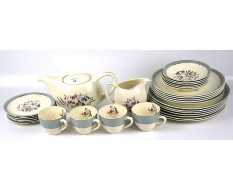 A Bristol part tea and dinner service. Comprising four cups and saucers, a teapot, milk jug and plates of various sizes, all 