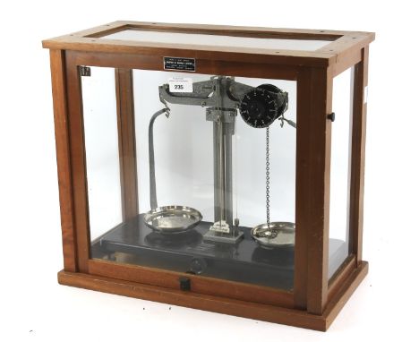 A set of Griffin and George Ltd scales. Within a wooden framed glazed display case, featuring a plaque, L46cm