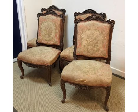 A set of four circa 1900 French carved walnut framed salon chairs with aubusson style tapestry upholstered backs and seats ra