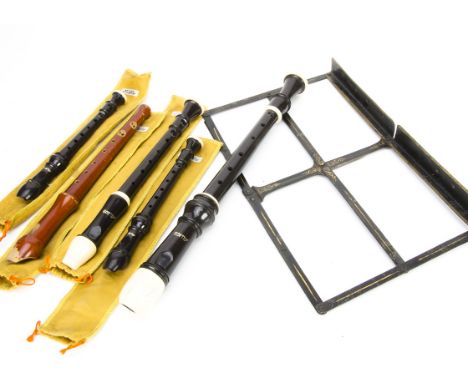 Recorders, five recorders of various sizes, four plastic and a wooden recorder with covers or case plus a metal music stand