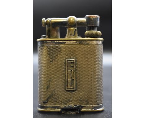 A Dunhill engine turned electroplate lighter,&nbsp;7.5cm high. 