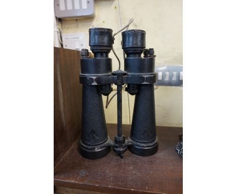 A pair of military binoculars, by Barr &amp; Stroud, with broad arrow marks. 