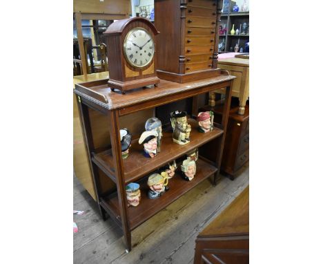 An Edwardian mahogany and line inlaid three tier buffet, 114cm wide.&nbsp; 