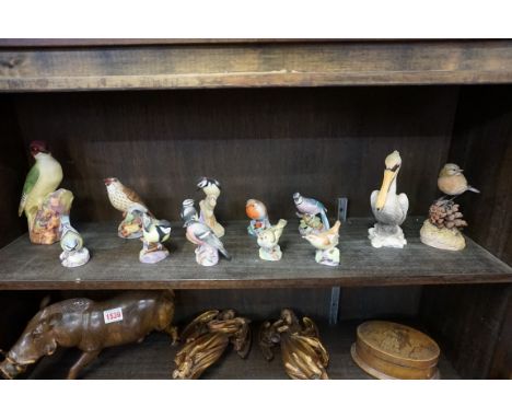 Ten Royal Worcester birds,&nbsp;(chips to beak of Thrush and Wren); together with two other resin bird models. (12) 