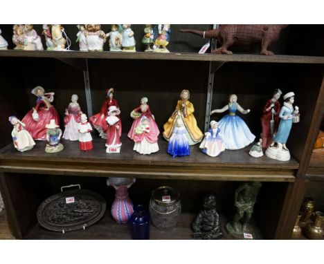 Fifteen Royal Doulton figures;&nbsp;together with a Goebel figure of a lady, 21.5cm high. (16) 