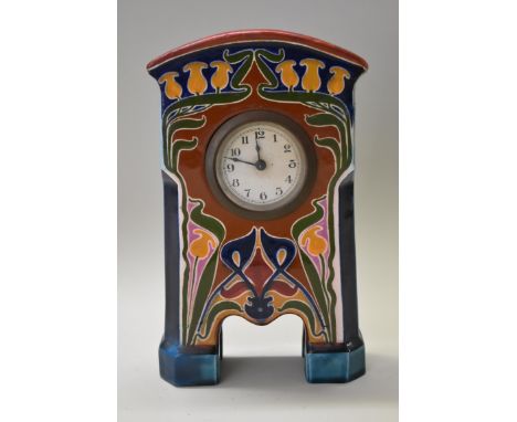 An Art Nouveau Continental pottery timepiece, possibly Gouda, 21cm high, (restoration). 