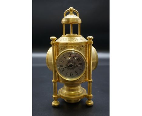 A Franklin Mint brass 'International Meteorological Clock', height including ring handle 26.5cm, with instructions. 