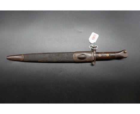 A Victorian British Army 1888 MkII Lee Metford bayonet and scabbard, by Wilkinson Sword, the 30cm blade stamped 'VR WD' and d