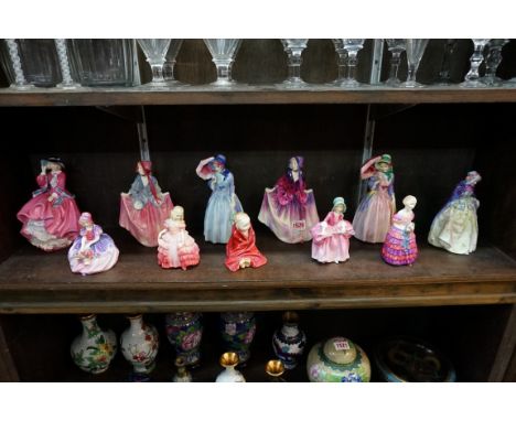 A collection of eleven Royal Doulton figures, comprising: 'Top o' The Hill', HN1849, (tiny chip to brim of hat); 'Monica', HN