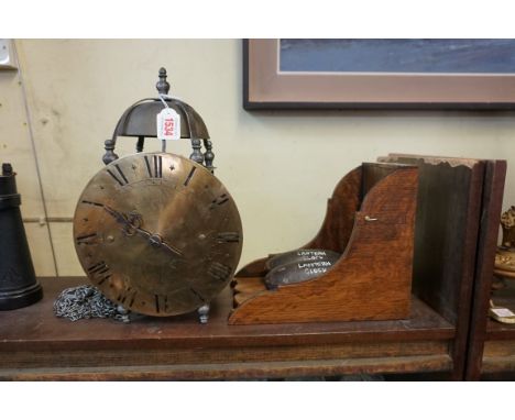 An antique French lantern clock, the 8 1/2in circular dial inscribed 'Yous, A Vaubadon', 35cm high, with oak bracket, pendulu