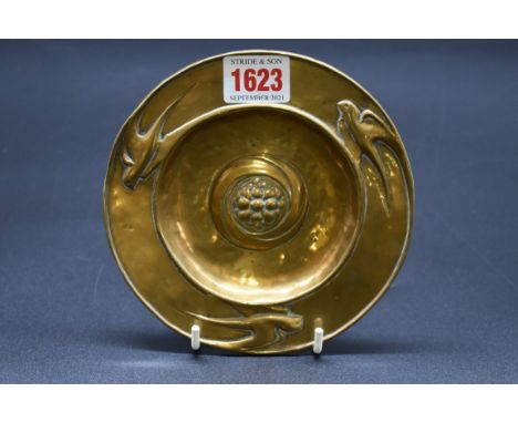 A rare small Glasgow School of Art brass card tray,&nbsp;attributed to Peter Wylie Davidson, embossed to the centre with a st