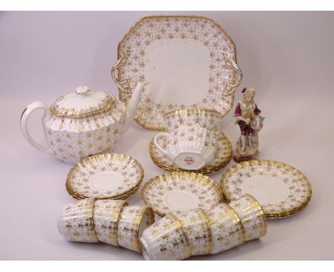 SPODE FLEUR DE LYS GOLD TEAWARE - approximately 25 pieces, a porcelain figurine of a lady, 16cms H