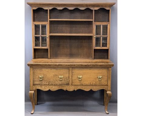 SHROPSHIRE OAK DRESSER - Early 20th century having a moulded cornice and shaped frieze over an arrangement of twin bevelled e