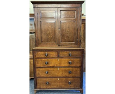 19th CENTURY OAK PRESS CUPBOARD, two piece, having a two door, three shelved upper section over a base of two short and three