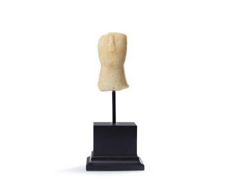  CYCLADIC IDOL HEAD CYCLADES, EARLY CYCLADIC II, C. 2600 - 2400 B.C. carved marble, the head upon a broad cylindrical neck, t