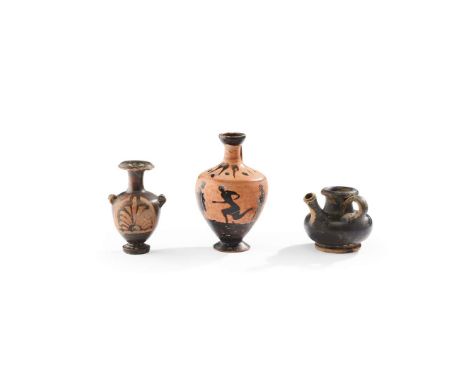 THREE APULIAN POTTERY VESSELS SOUTH ITALIAN, 4TH CENTURY B.C. the first a black figure squat lekythos, showing a running fig